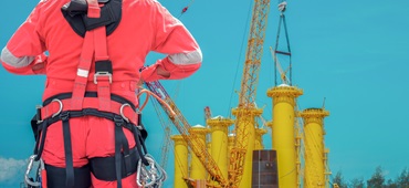 rear-view-man-working-construction-site-against-sky